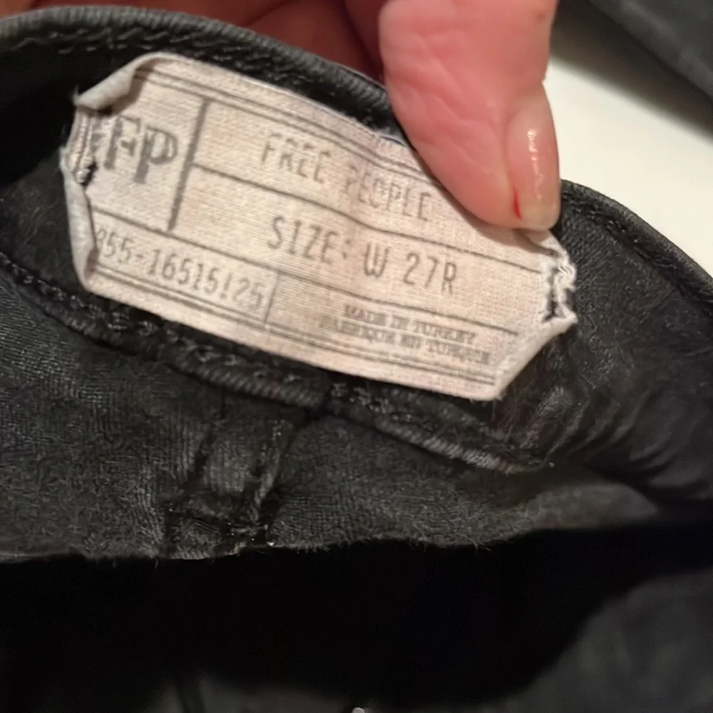 Free People size 27 Black Wash skinny jeans distressed with raw hem